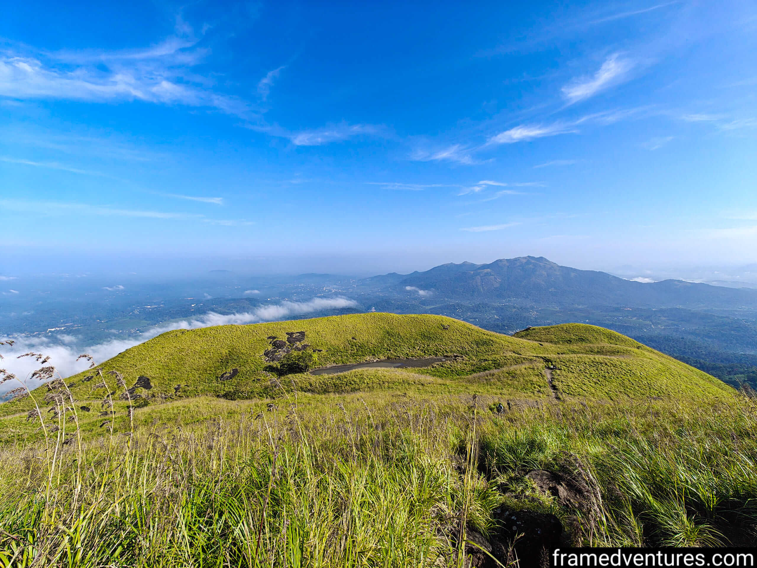A small pond on a meadow near Chembra Peak Framedventures