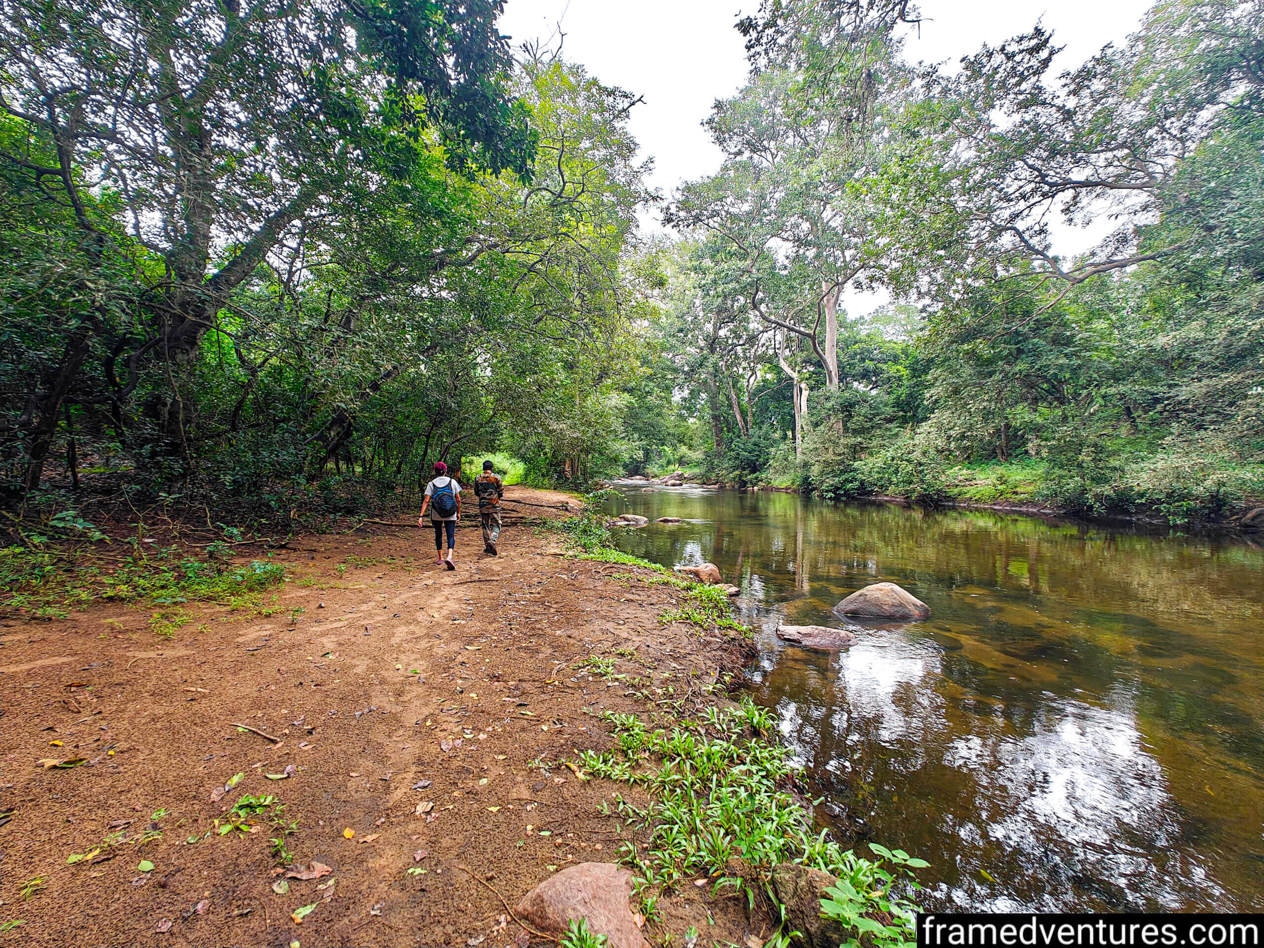 A tourist and a guide doing the Chinnar-Koottar trek in Marayoor