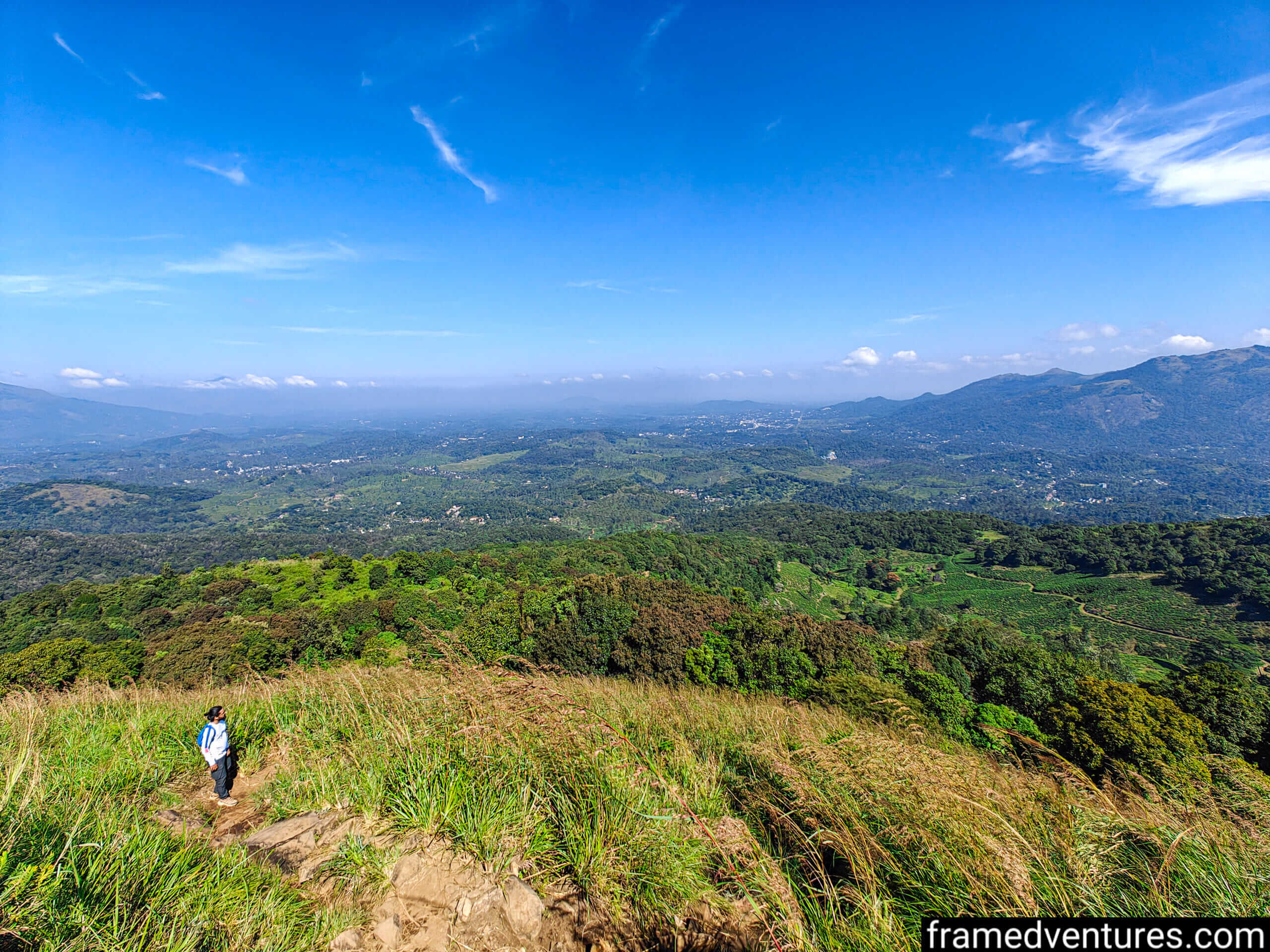 A trekker looking at the landscape near Chembra Peak Framedventures