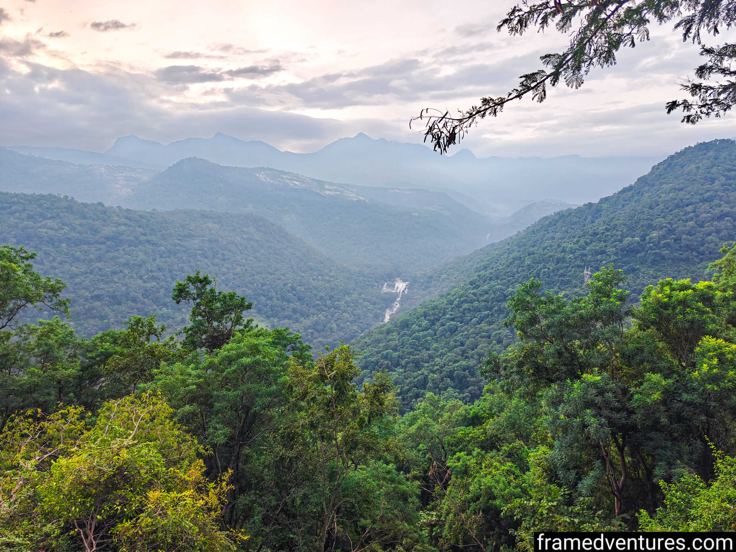 A view of Thoovanam Waterfall from the road