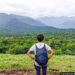 A woman observing the hills at Chinnar Wildlife Sanctuary