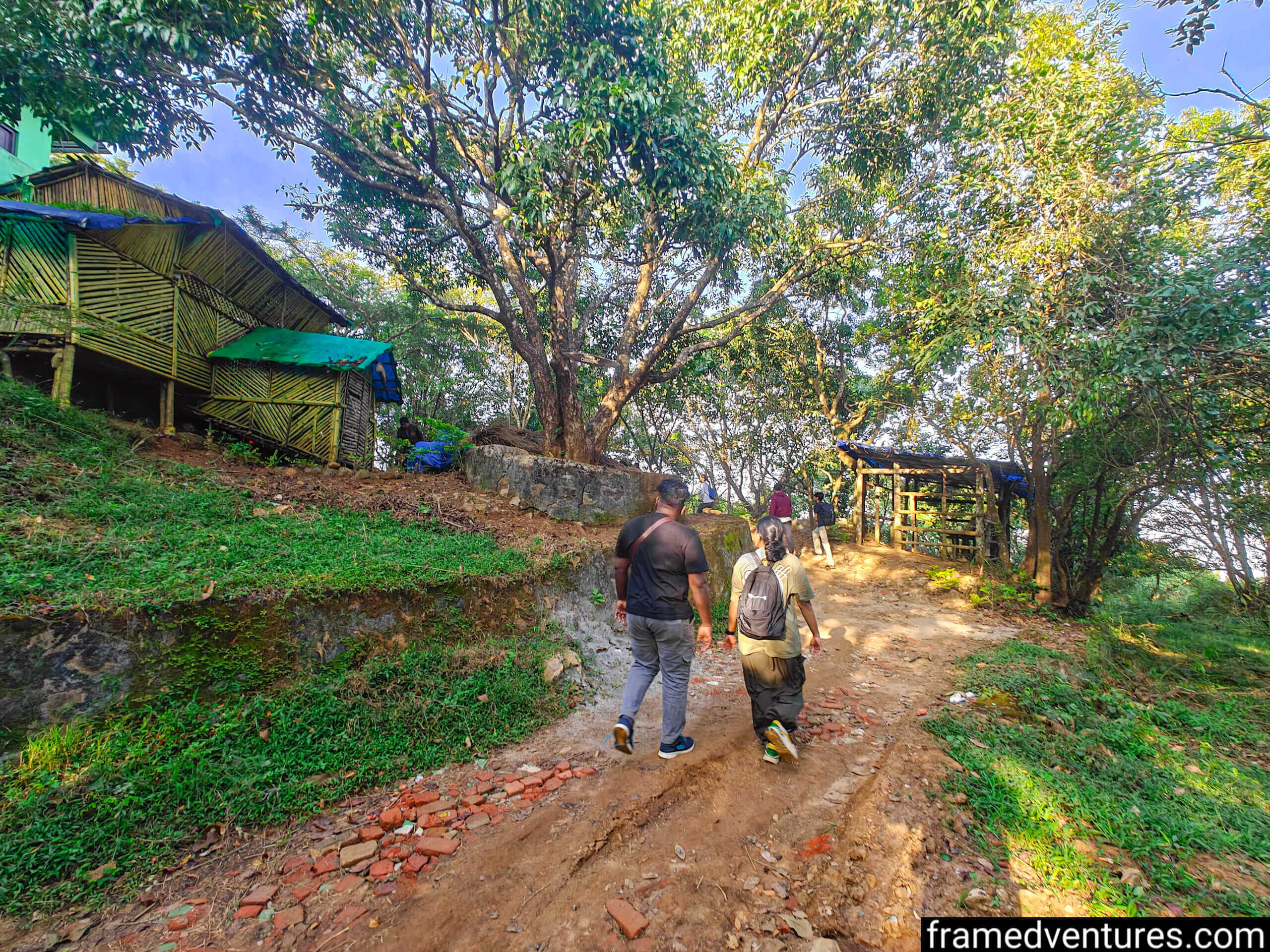 Two trekkers looking at the second Chembra Peak forest office